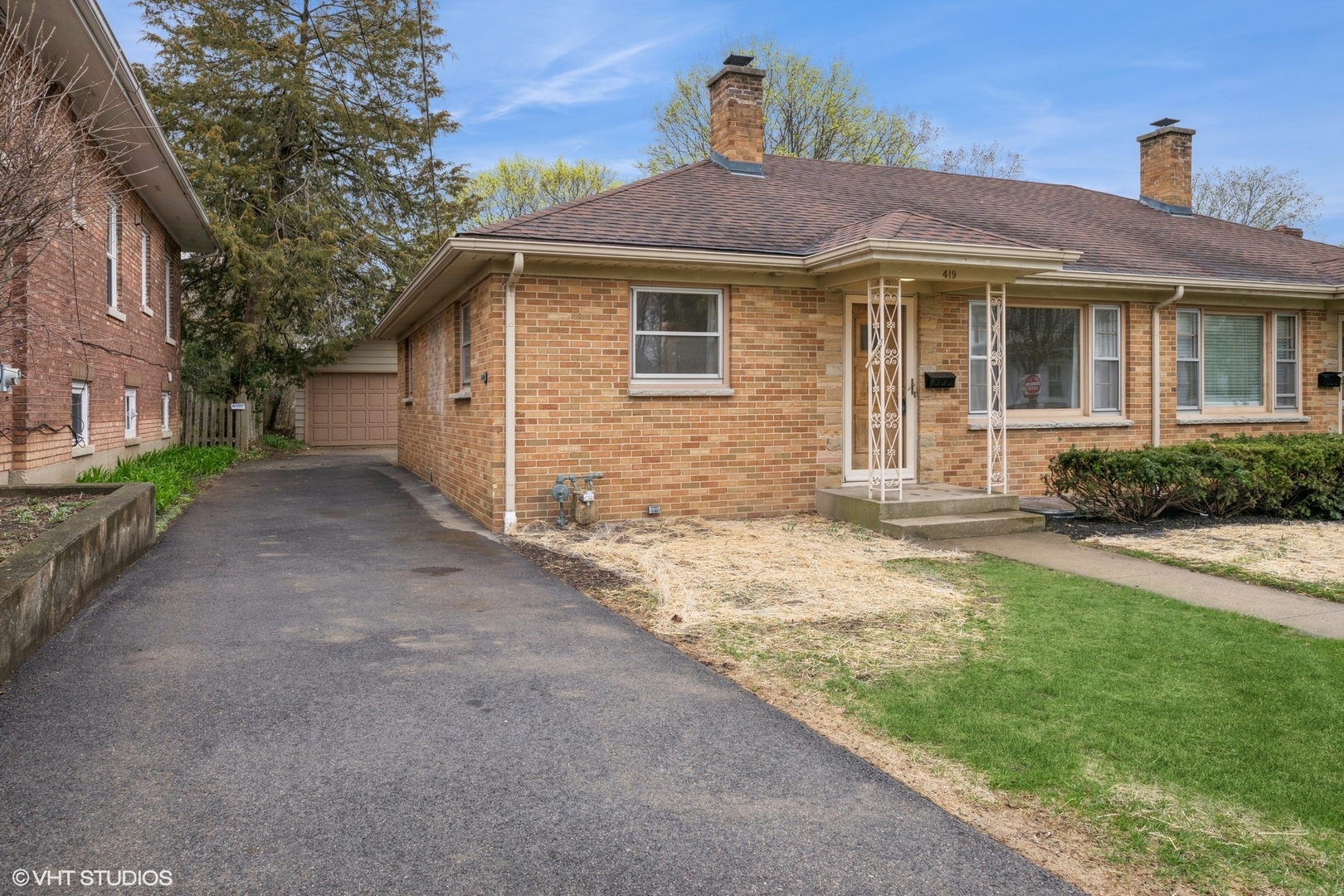 419 June Terrace Barrington, IL 60010 - Photo 1 of 18 a front view of a house with a yard