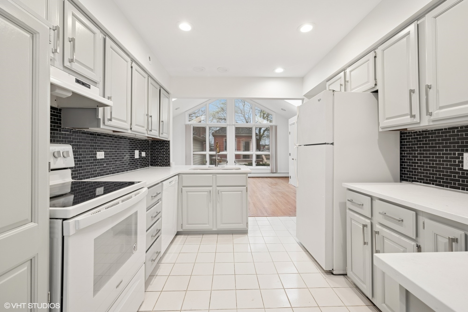 419 June Terrace Barrington, IL 60010 - Photo 3 of 18 a kitchen with stainless steel appliances granite countertop a refrigerator sink and cabinets