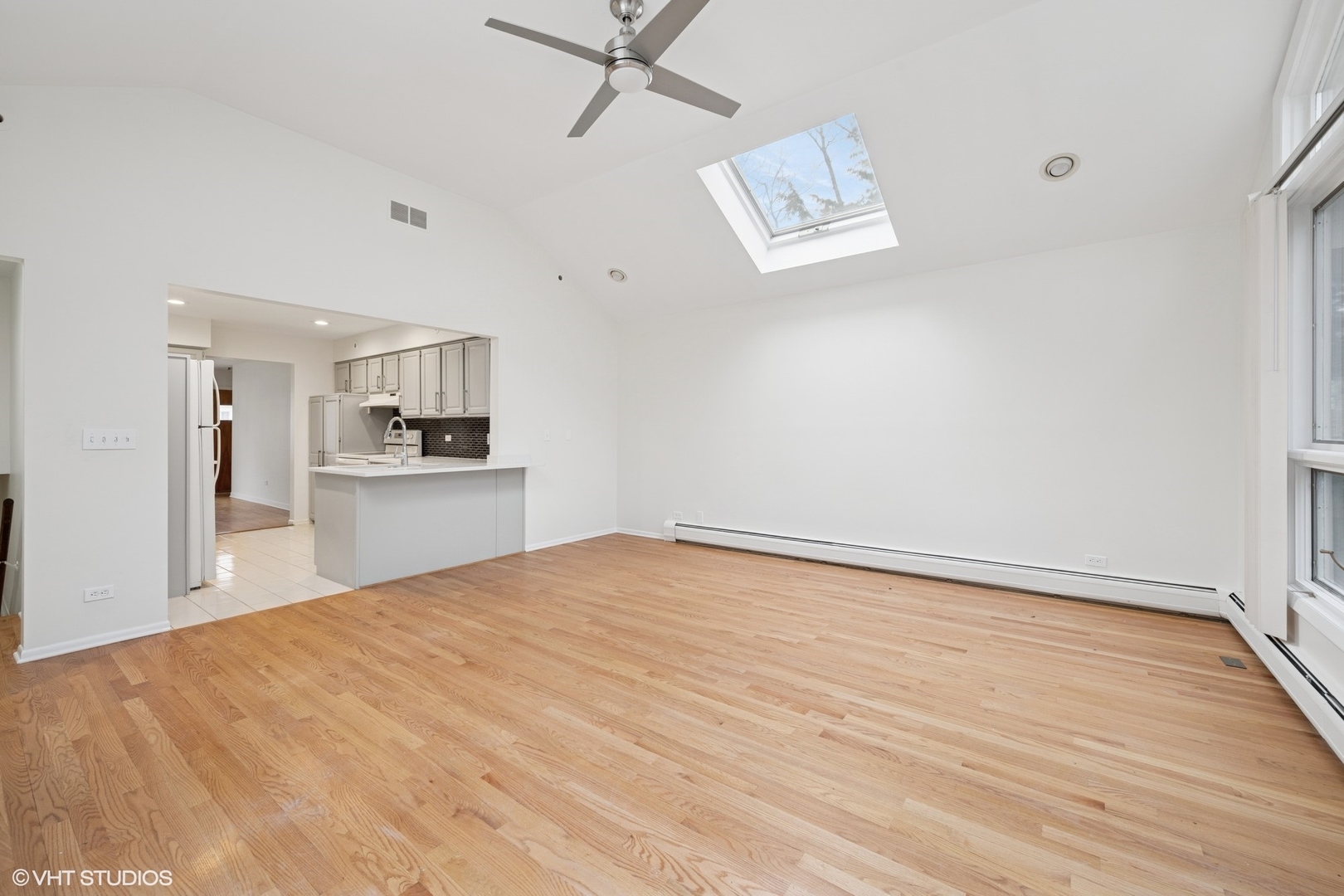 419 June Terrace Barrington, IL 60010 - Photo 6 of 18 a view of empty room with wooden floor and kitchen