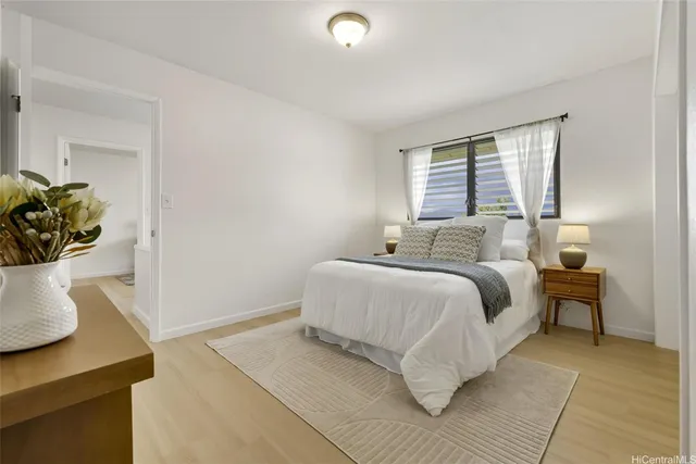 a bathroom with a sink toilet a mirror and shower