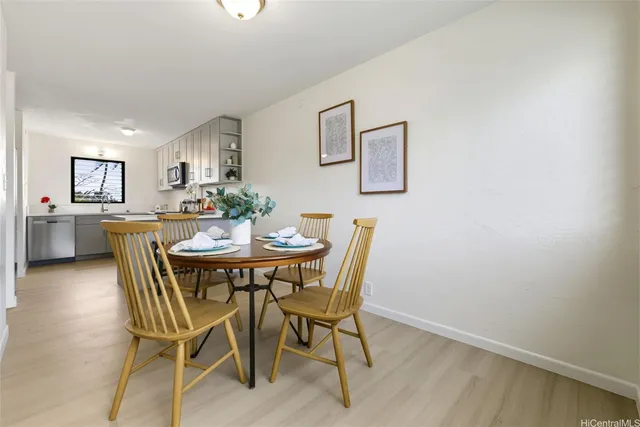 a view of a dining room with furniture and window