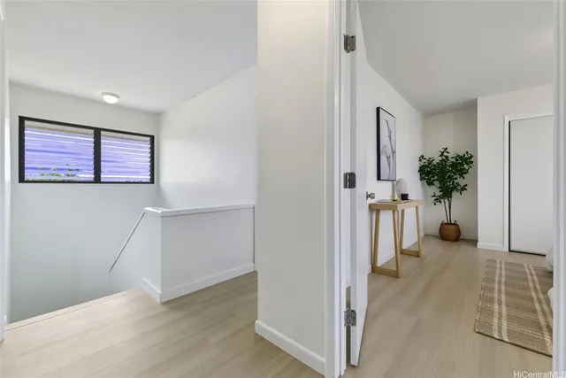 a spacious bedroom with a bed and a couch