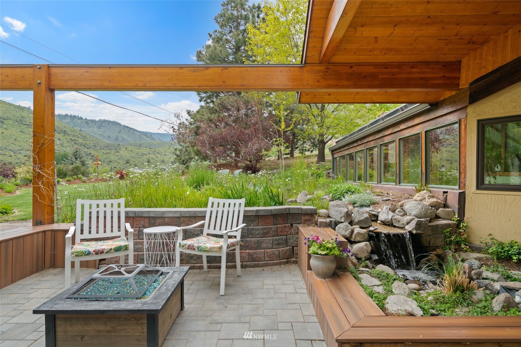 1666 Pitcher Canyon Road Wenatchee, WA 98801 - Photo 4 of 37 a view of a patio with a table and chairs