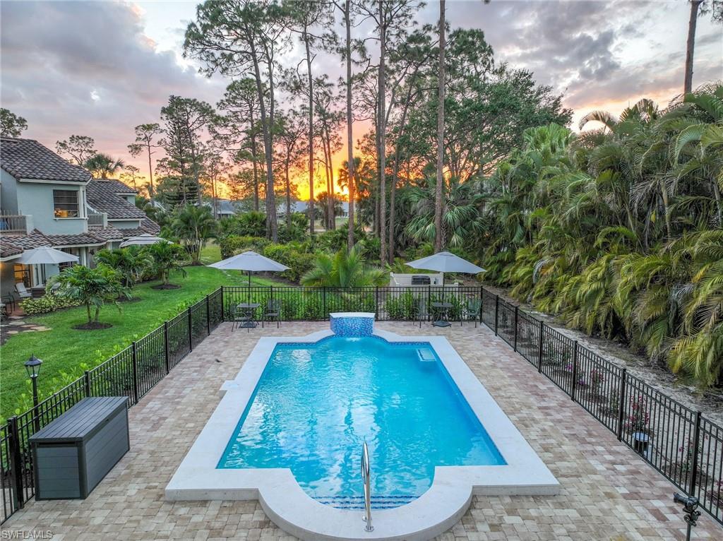 2708 Santa Cruz Boulevard Naples, FL 34112 - Photo 13 of 38 a view of a backyard with swimming pool