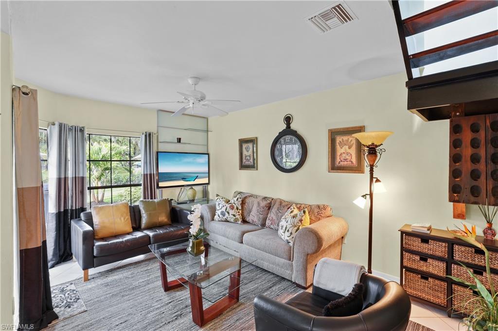 2708 Santa Cruz Boulevard Naples, FL 34112 - Photo 23 of 38 a living room with furniture and a window