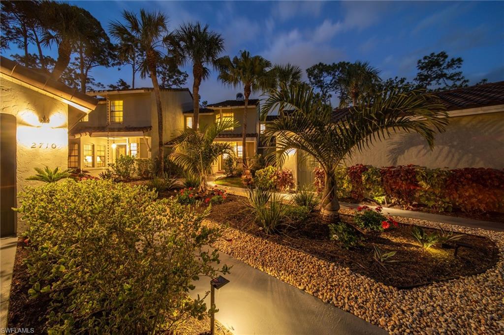 2708 Santa Cruz Boulevard Naples, FL 34112 - Photo 7 of 38 a view of a house with a yard