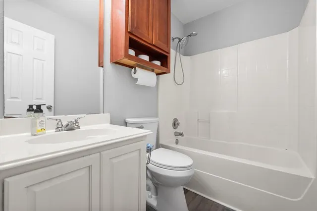 a bathroom with a sink a toilet and bathtub