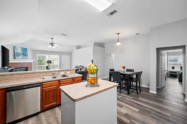 a kitchen with a sink and cabinets