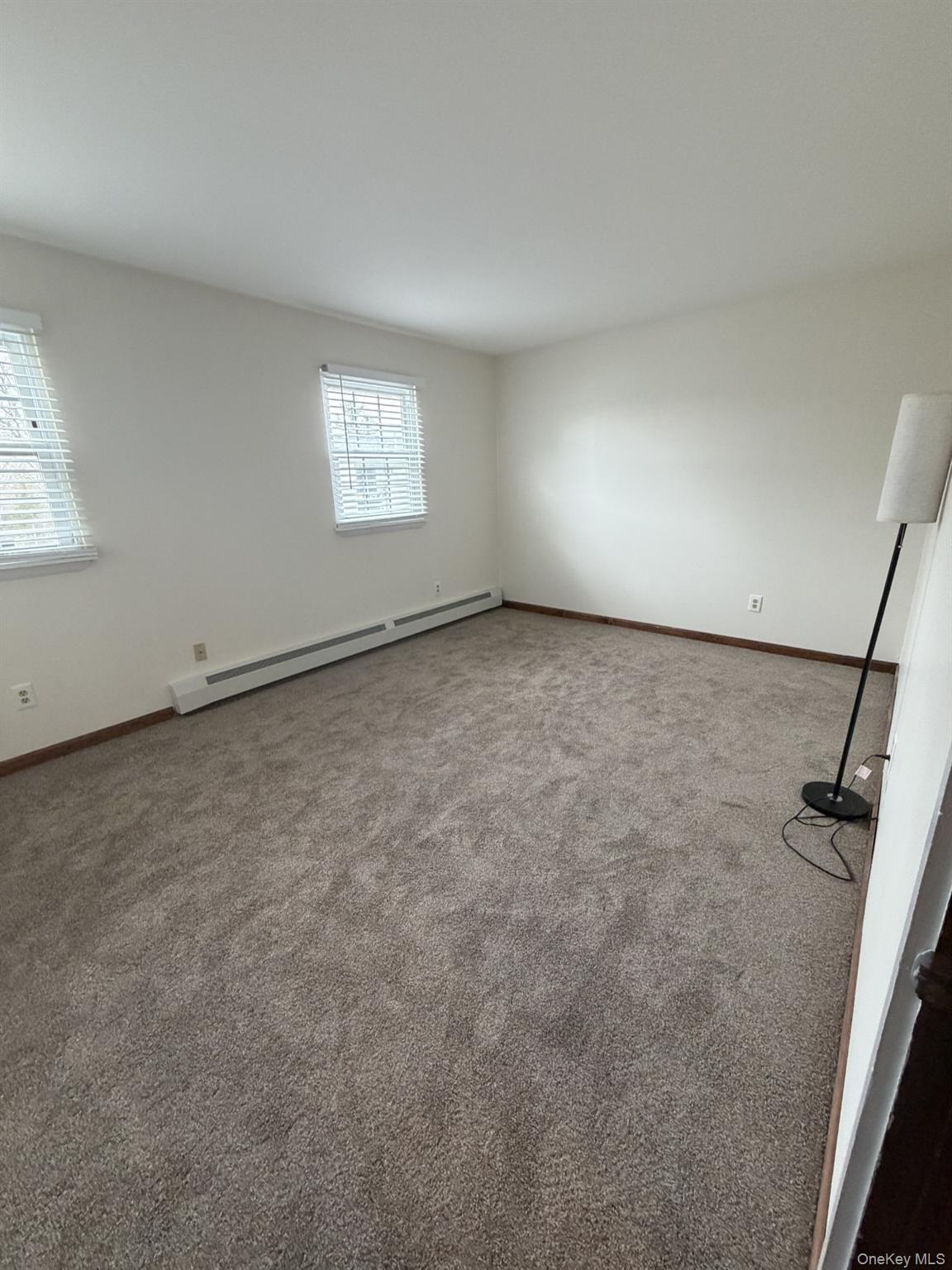 7 Ivy Court, Unit B Fishkill, NY 12524 - Photo 11 of 15 an empty room with windows