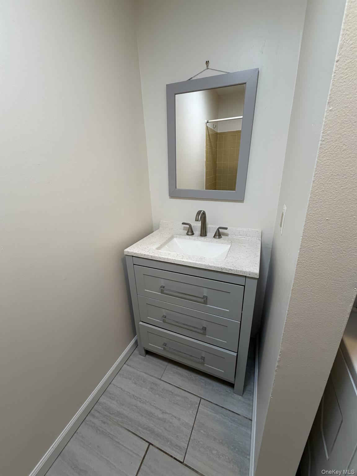 7 Ivy Court, Unit B Fishkill, NY 12524 - Photo 7 of 15 a bathroom with a sink and a mirror