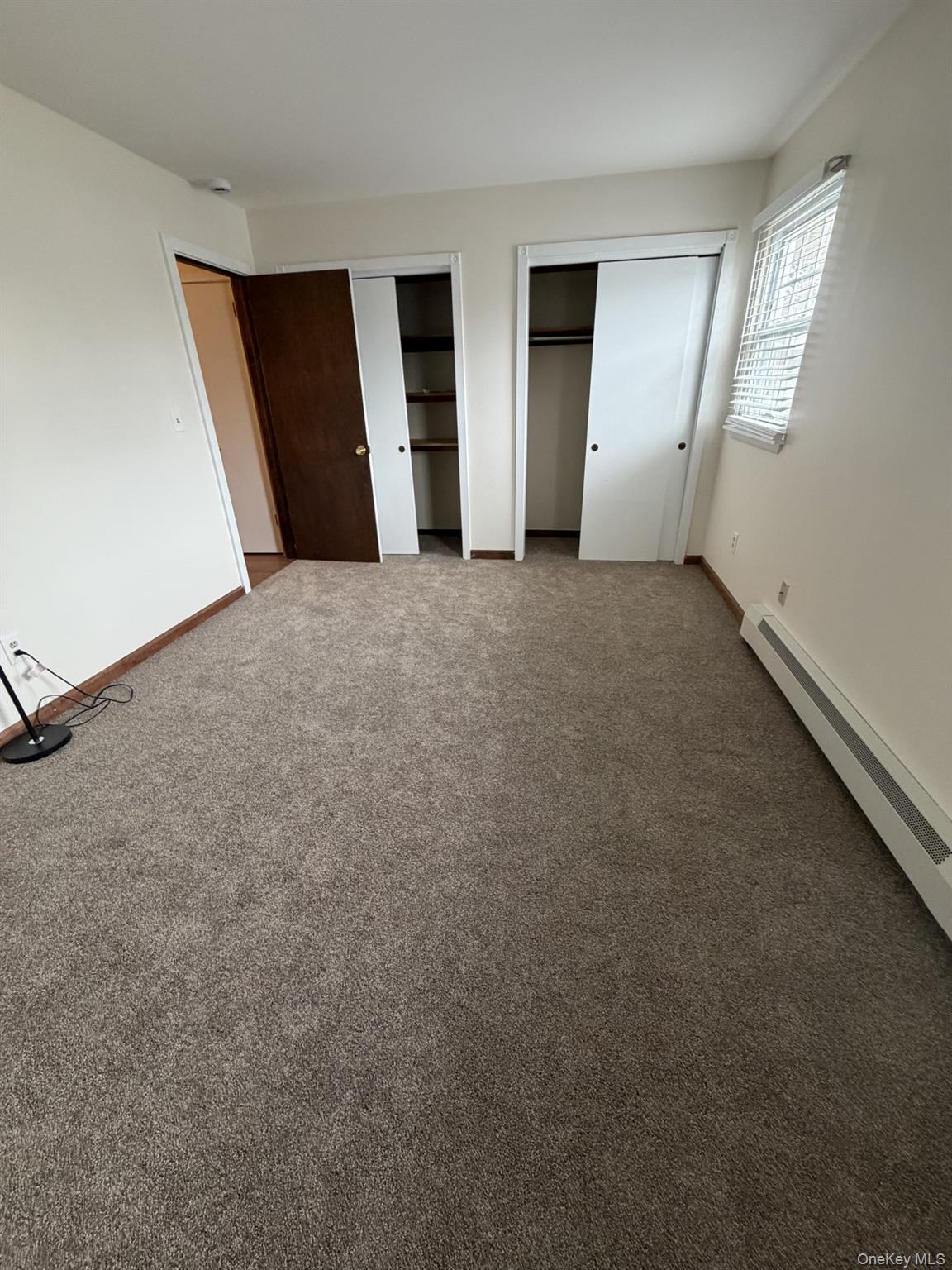 7 Ivy Court, Unit B Fishkill, NY 12524 - Photo 10 of 15 an empty room with windows and pillars in it