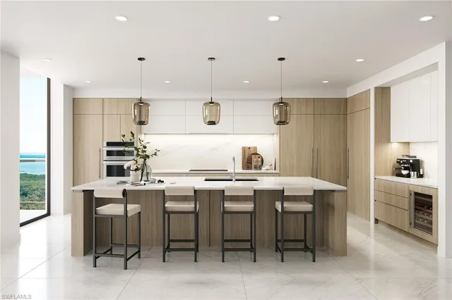 a kitchen that has a table and chairs in it