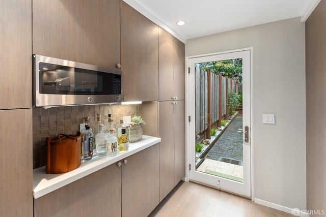 a bedroom with furniture and wooden floor