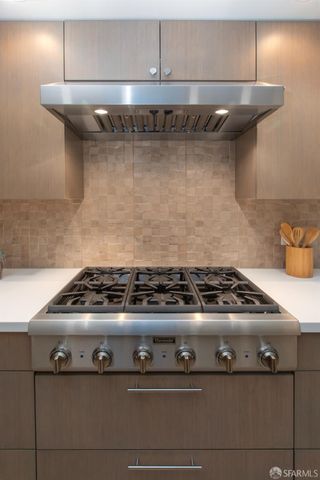 a bed room with bed and cabinets