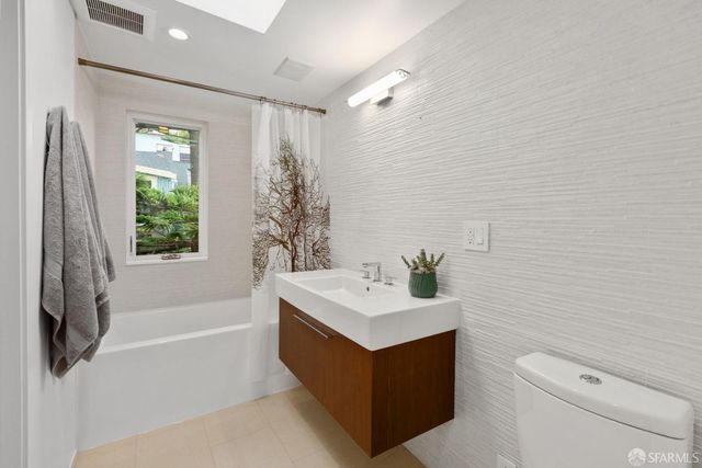 a man sitting on a bench in a room