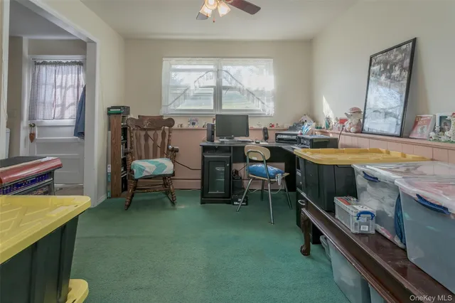 a room with table chairs and a window