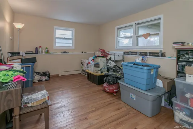 a room with wooden furniture and a window
