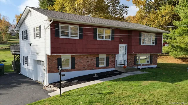 a front view of a house with a yard