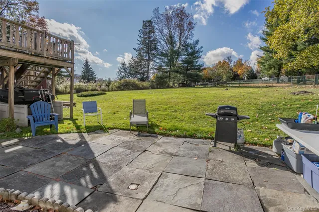 a view of a garden with sitting area