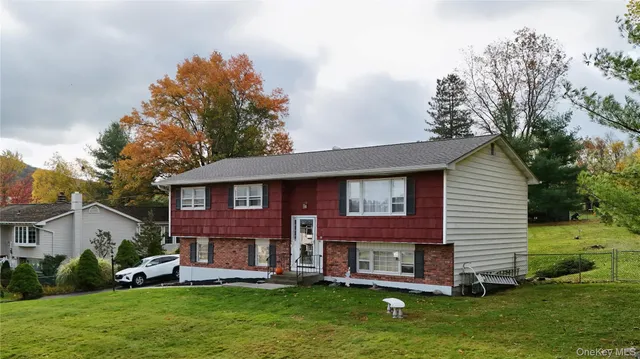 a view of a house with a yard porch and sitting area