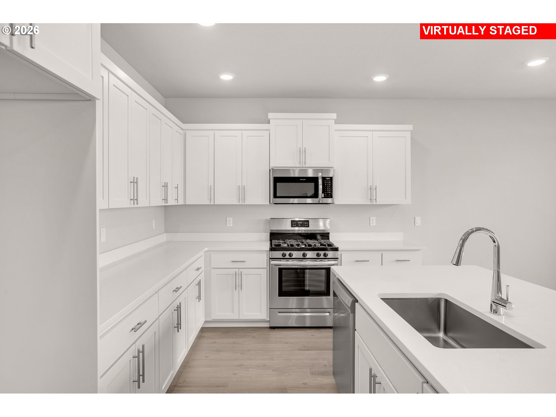 1109 Clemson Street Gervais, OR 97026 - Photo 14 of 22 a kitchen with white cabinets sink and white appliances