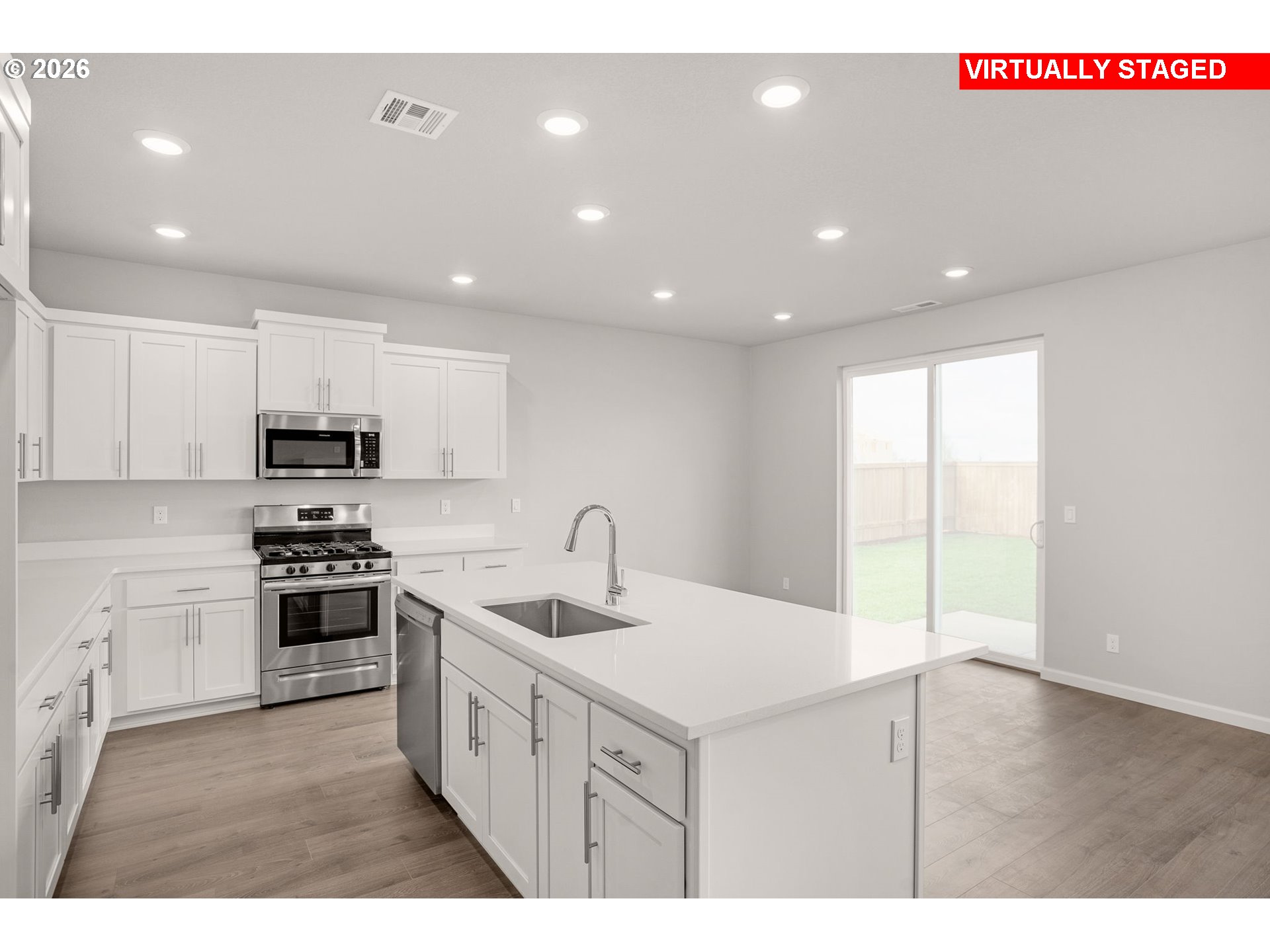 1109 Clemson Street Gervais, OR 97026 - Photo 5 of 22 a kitchen with a sink window and stainless steel appliances