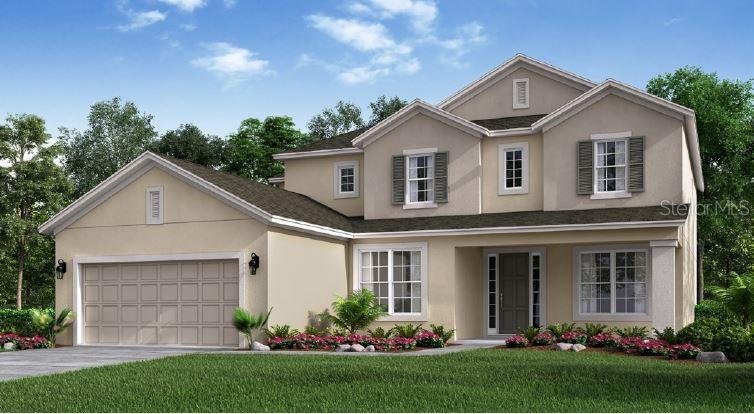 a front view of a house with a garden and plants