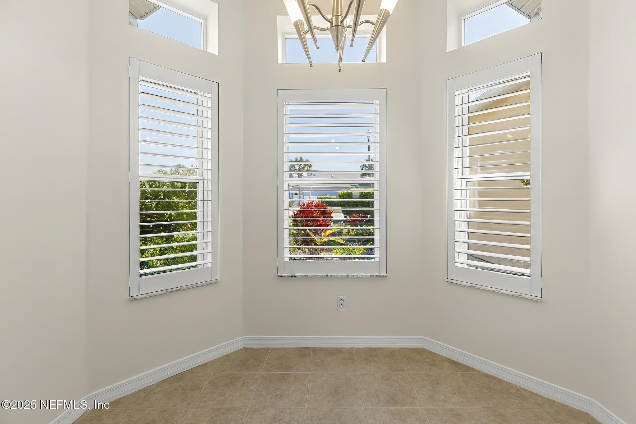 180 Kingston Drive St. Augustine, FL 32084 - Photo 15 of 55 a view of an empty room with a window