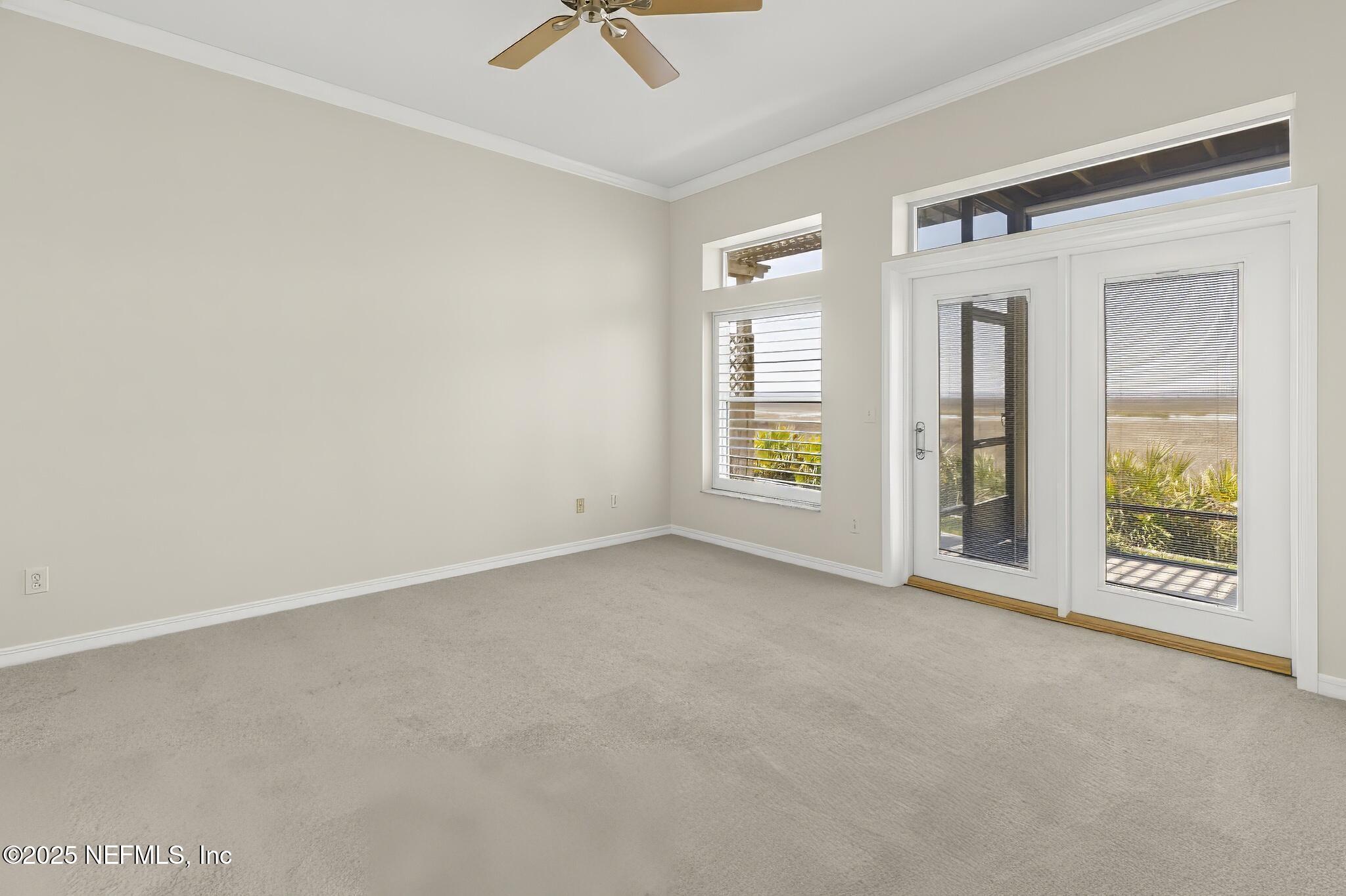 180 Kingston Drive St. Augustine, FL 32084 - Photo 18 of 55 an empty room with windows and closet