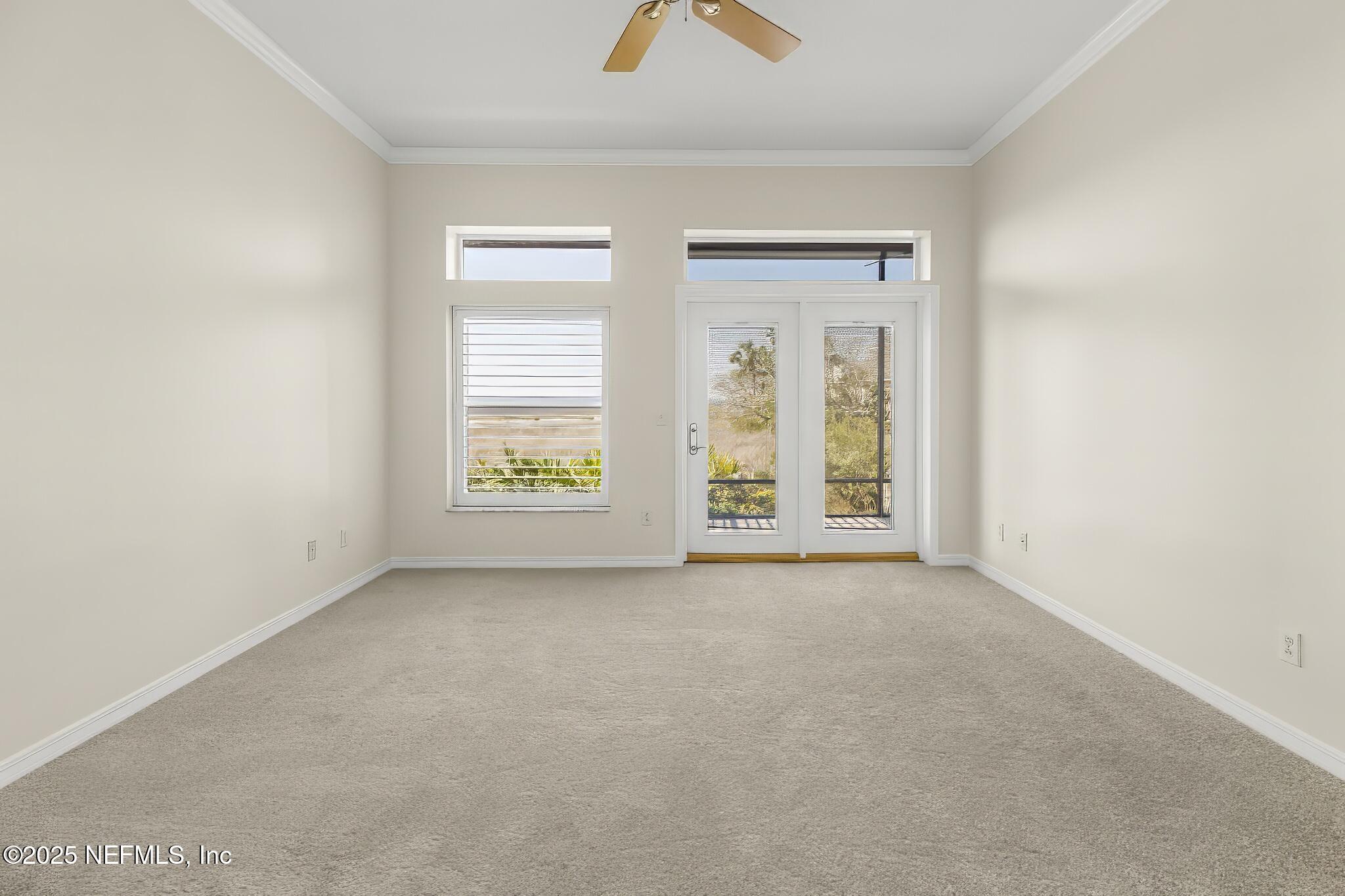 180 Kingston Drive St. Augustine, FL 32084 - Photo 20 of 55 an empty room with windows and closet