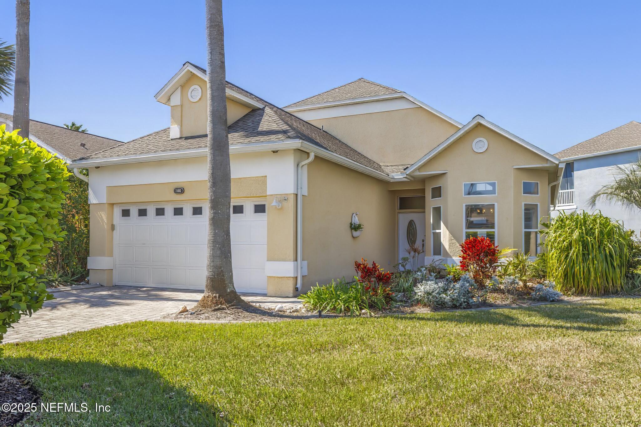 180 Kingston Drive St. Augustine, FL 32084 - Photo 2 of 55 a front view of house with yard