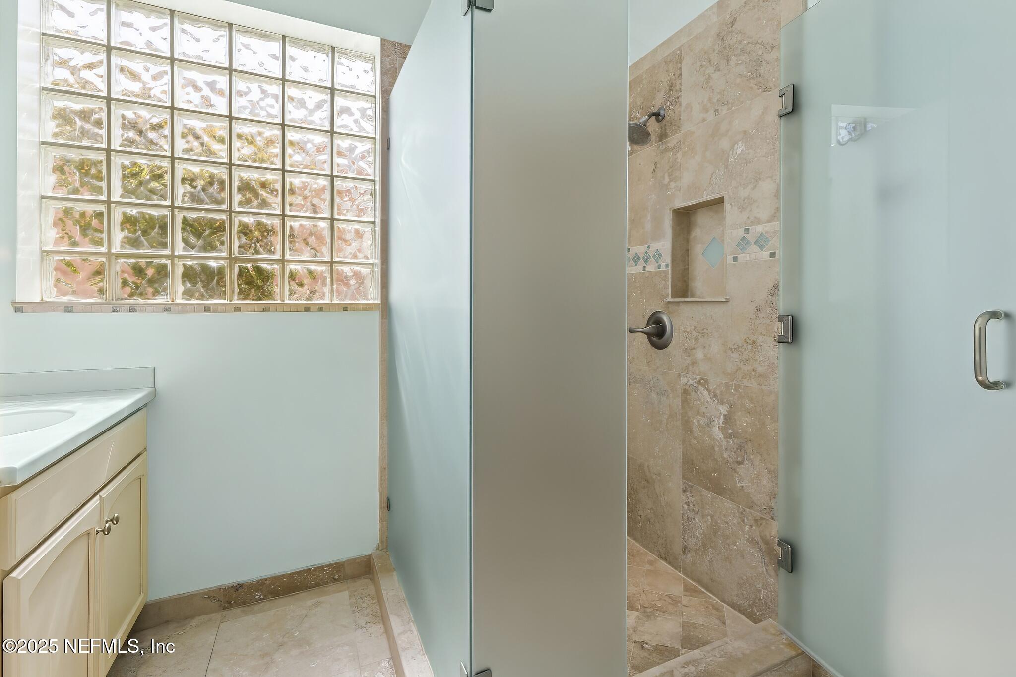 180 Kingston Drive St. Augustine, FL 32084 - Photo 22 of 55 a bathroom with a shower