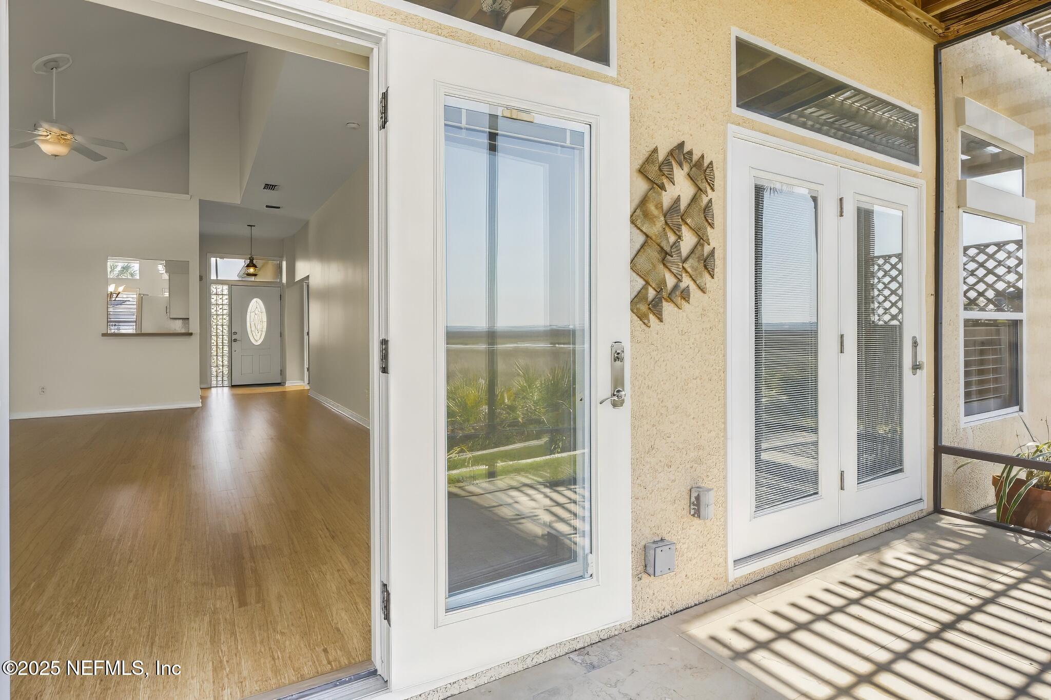180 Kingston Drive St. Augustine, FL 32084 - Photo 27 of 55 a view of a hallway with wooden floor and a dining room
