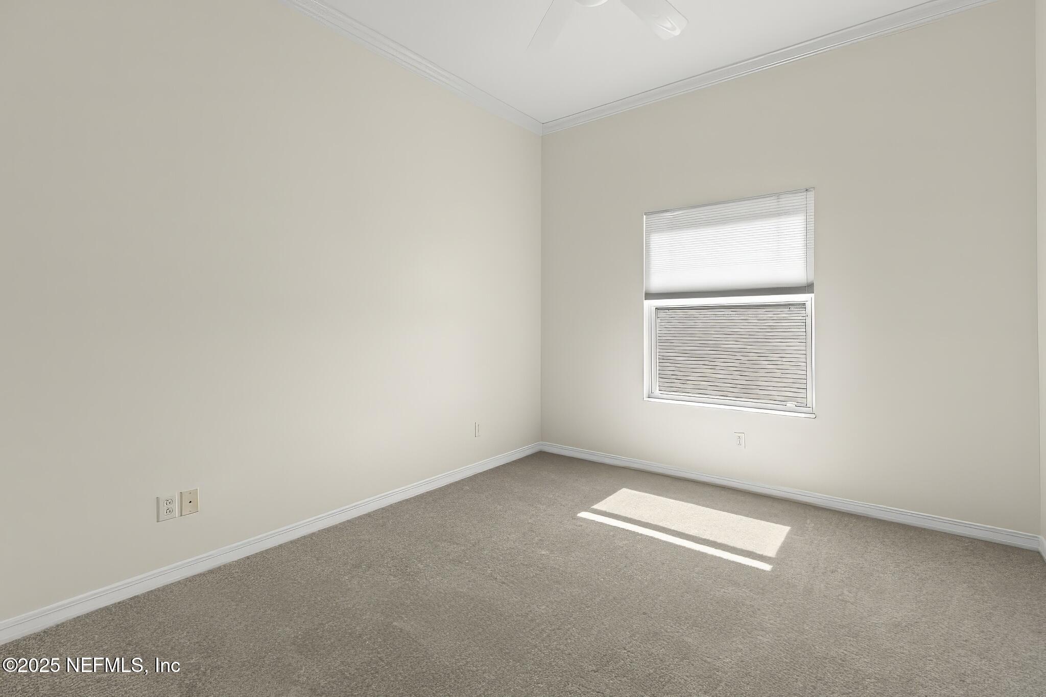 180 Kingston Drive St. Augustine, FL 32084 - Photo 30 of 55 an empty room with a window