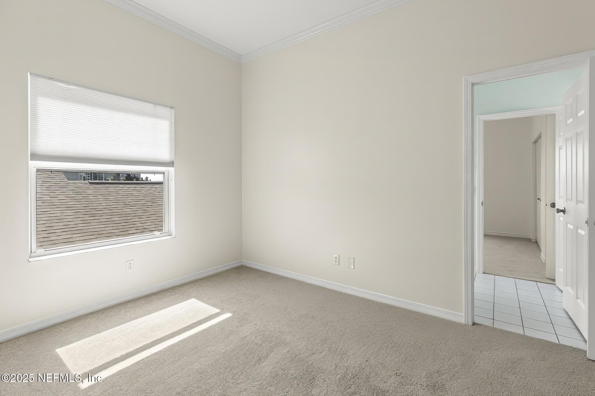 180 Kingston Drive St. Augustine, FL 32084 - Photo 31 of 55 an empty room with a window