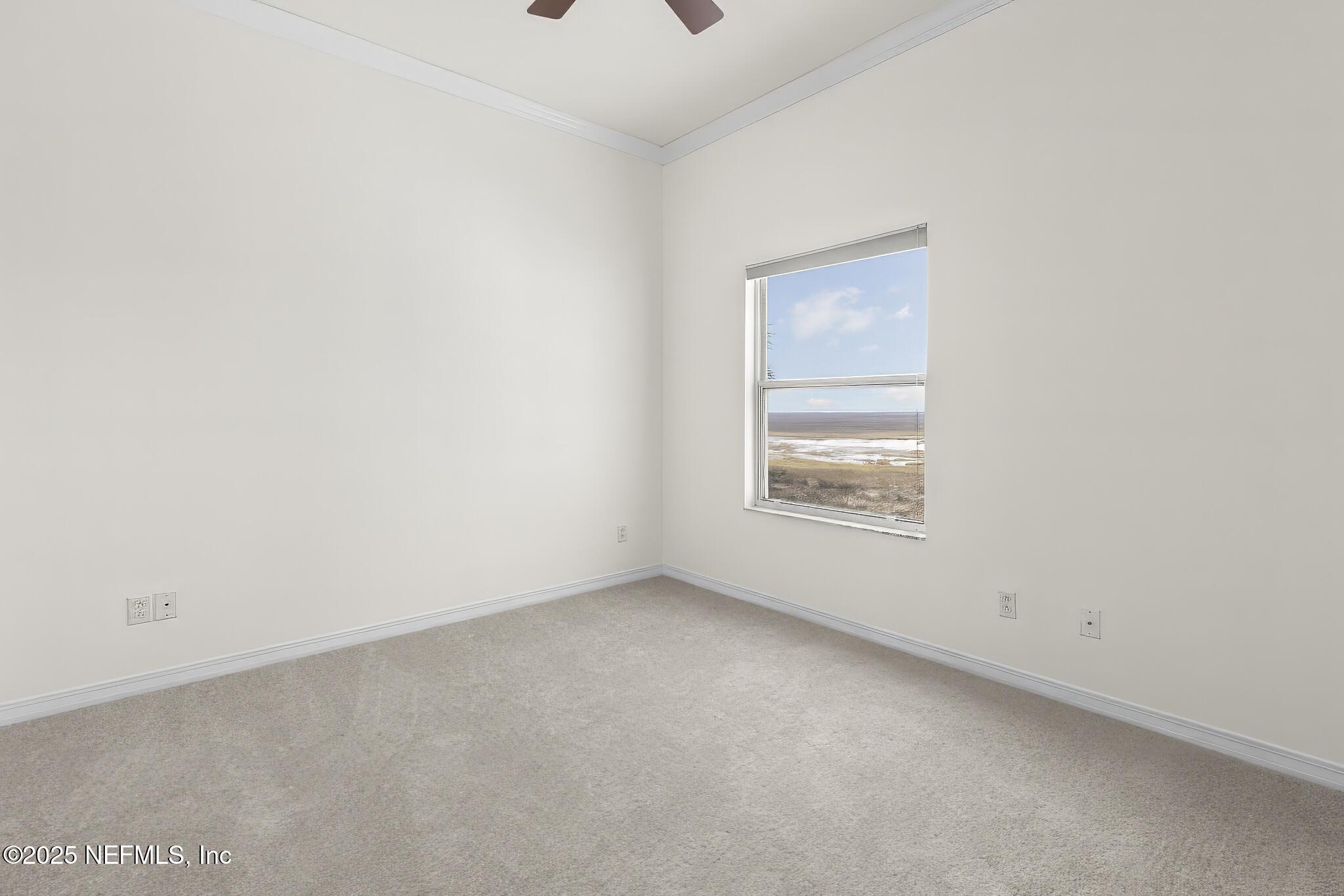 180 Kingston Drive St. Augustine, FL 32084 - Photo 34 of 55 a view of an empty room with a window