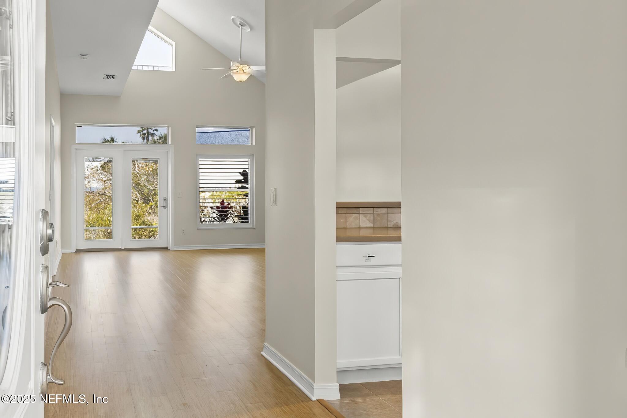 180 Kingston Drive St. Augustine, FL 32084 - Photo 4 of 55 wooden floor in a hall with an entryway