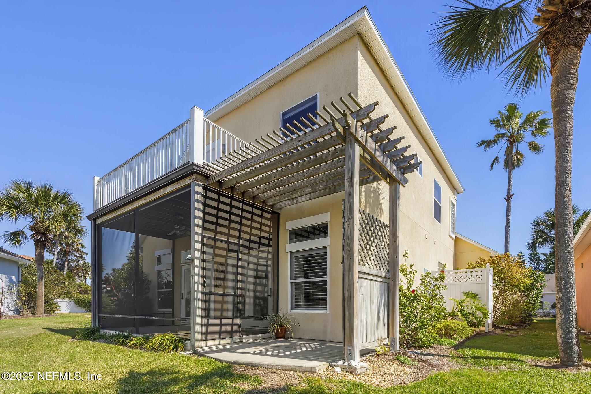 180 Kingston Drive St. Augustine, FL 32084 - Photo 45 of 55 a front view of a house with garden