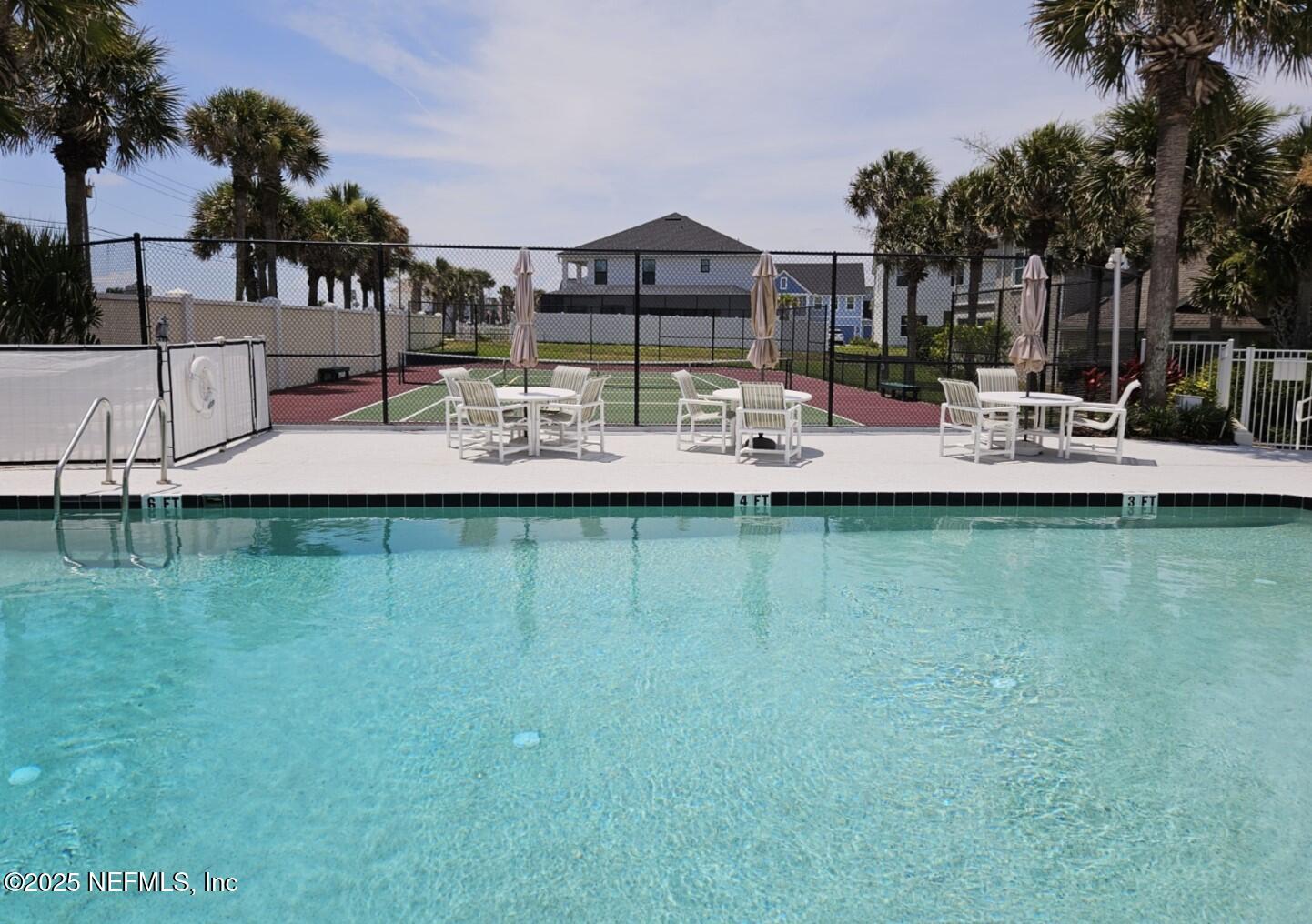 180 Kingston Drive St. Augustine, FL 32084 - Photo 54 of 55 a front view of a house with swimming pool and a yard