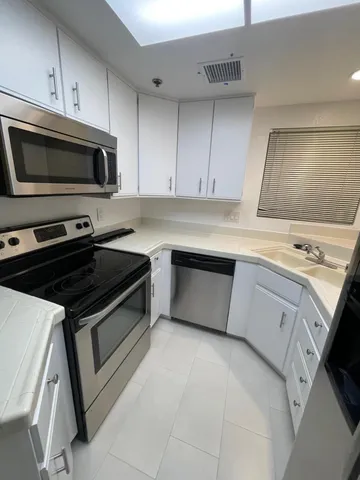 a kitchen with a stove and a microwave