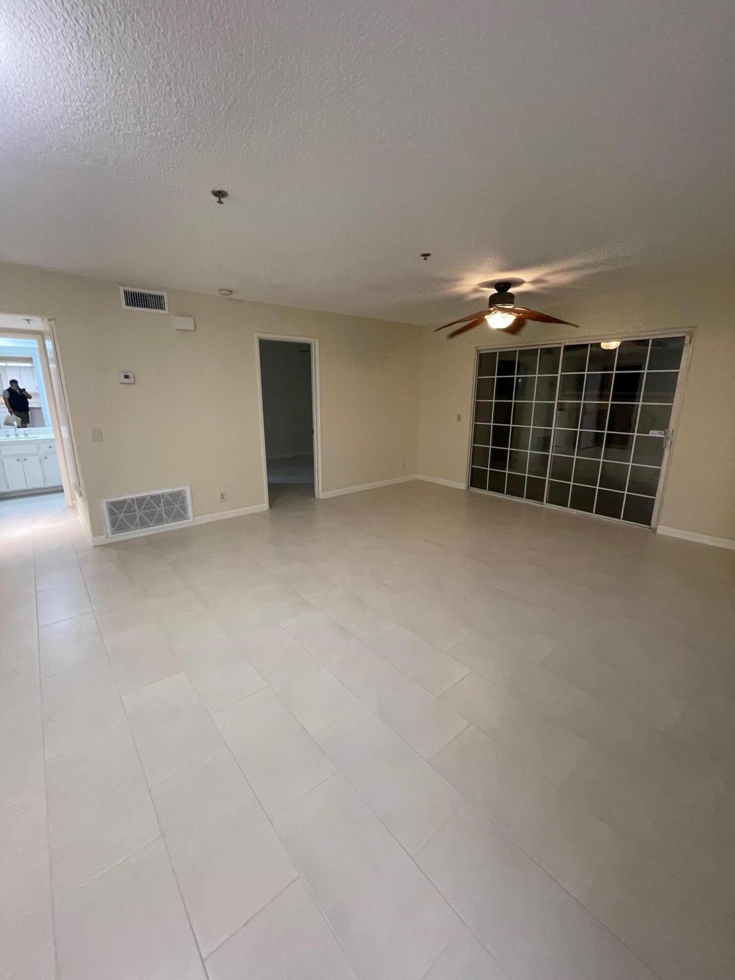 2700 Lawrence Crossley Road, Unit 4 Palm Springs, CA 92264 - Photo 5 of 18 an empty room with windows