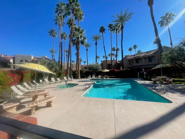 a view of a yard with cars