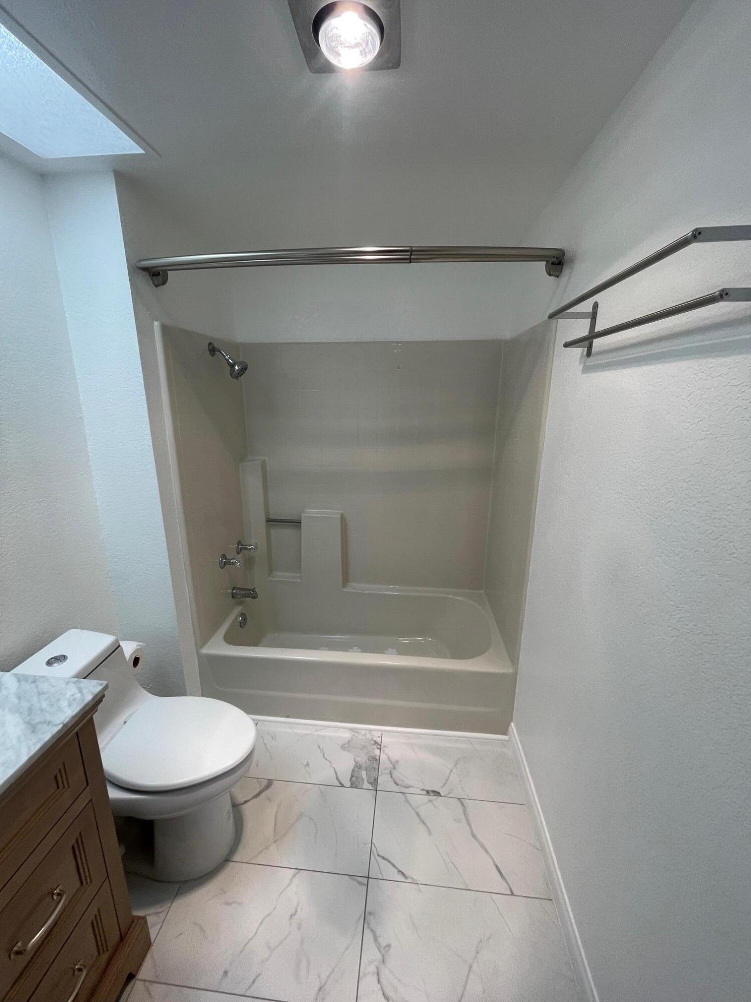 2700 Lawrence Crossley Road, Unit 4 Palm Springs, CA 92264 - Photo 10 of 18 a bathroom with a toilet and a shower