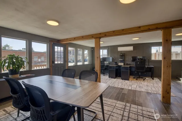a dining room with furniture and window
