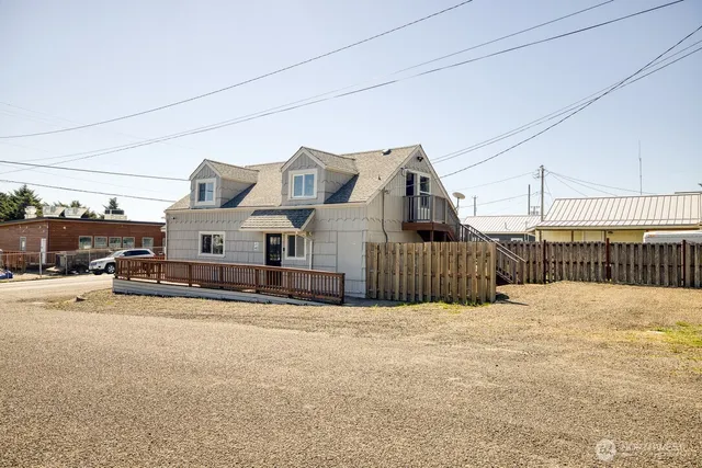 a view of a house with a snow in the background
