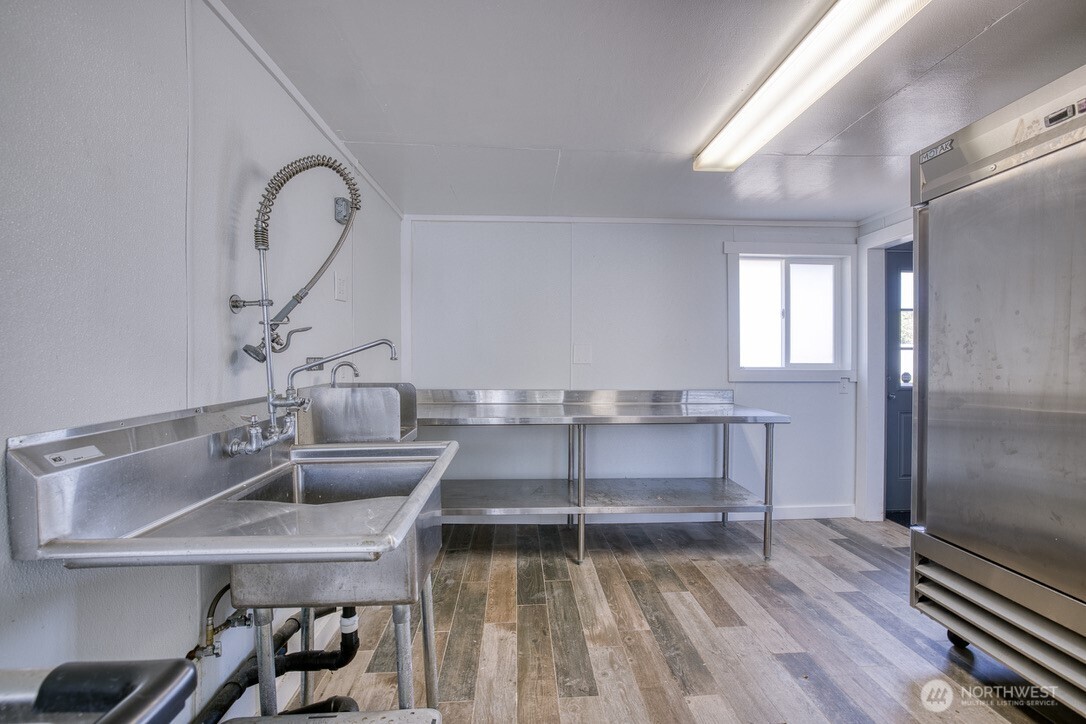 40 Main Street Pacific Beach, WA 98571 - Photo 21 of 40 a view of a bathroom sink and a window