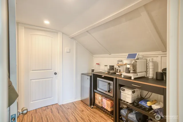 a view of a dining room with furniture and wooden floor