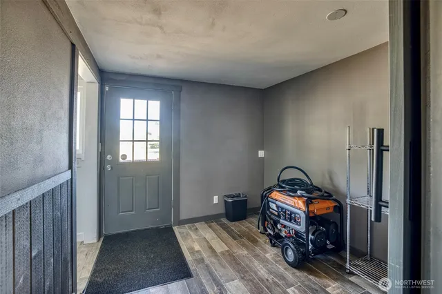 a view of a bedroom with a bed and a window