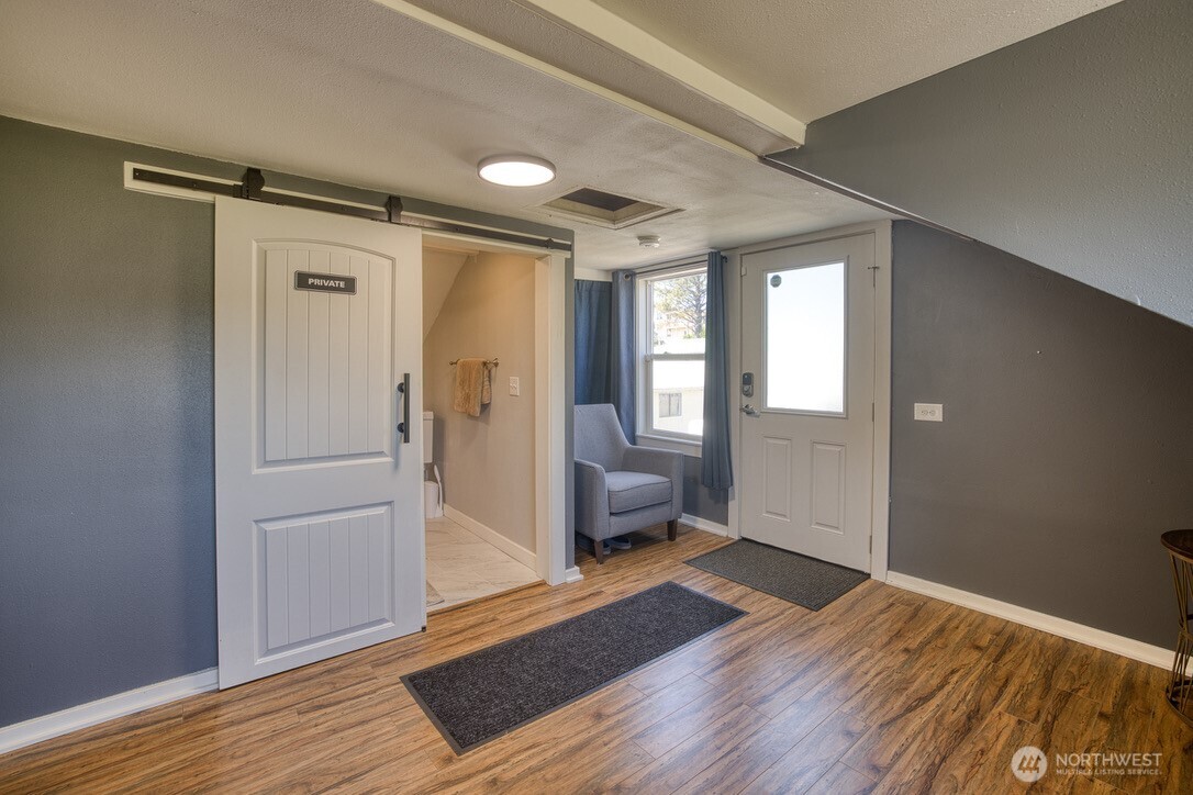 40 Main Street Pacific Beach, WA 98571 - Photo 35 of 40 a view of livingroom with hardwood floor and a ceiling fan
