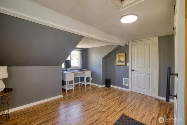 a room that has a bed and a chair in it